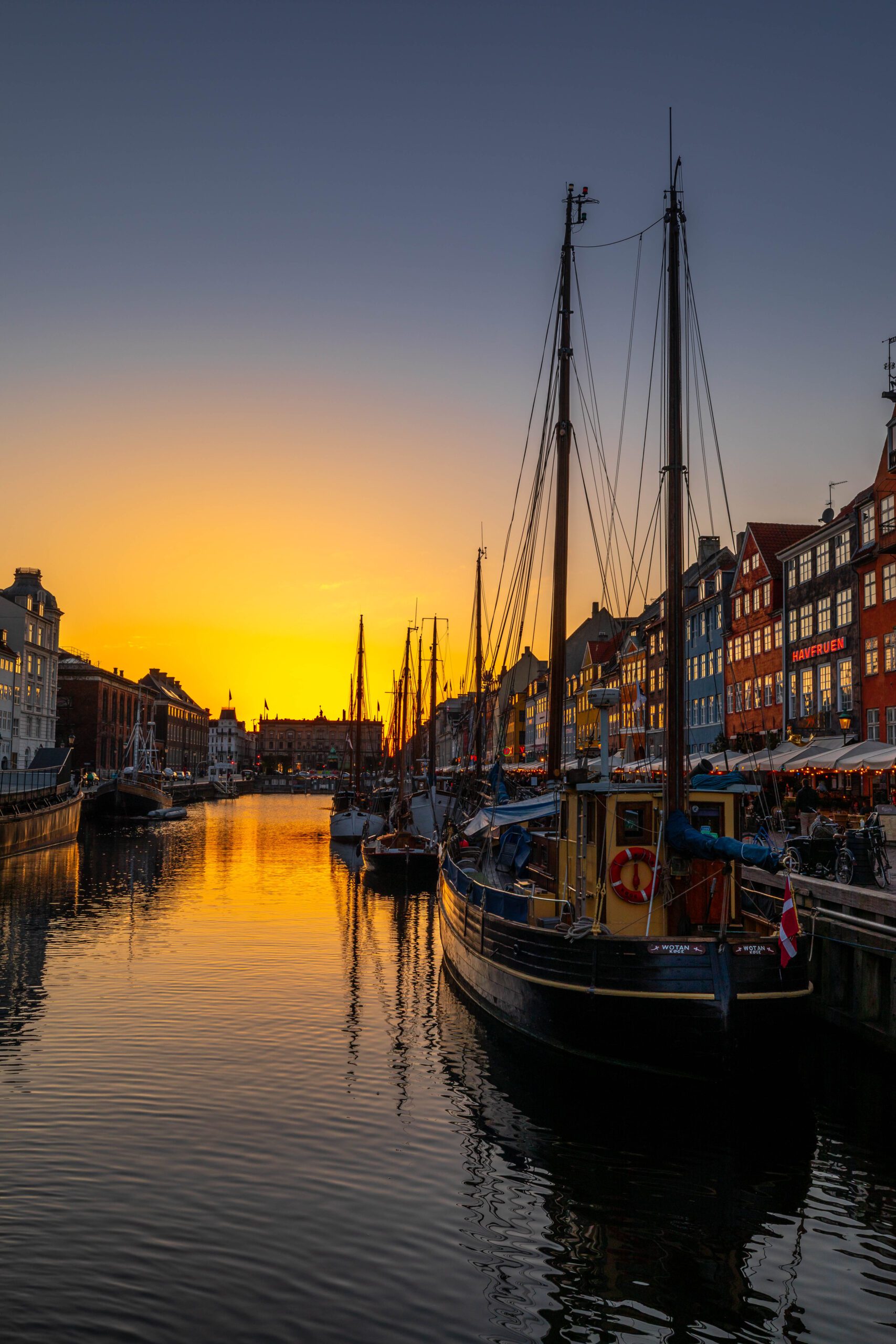 Sunset over Copenhagen, Denmark, with colourful buildings and waterfront reflections