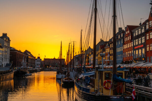 Sunset over Copenhagen, Denmark, with colourful buildings and waterfront reflections