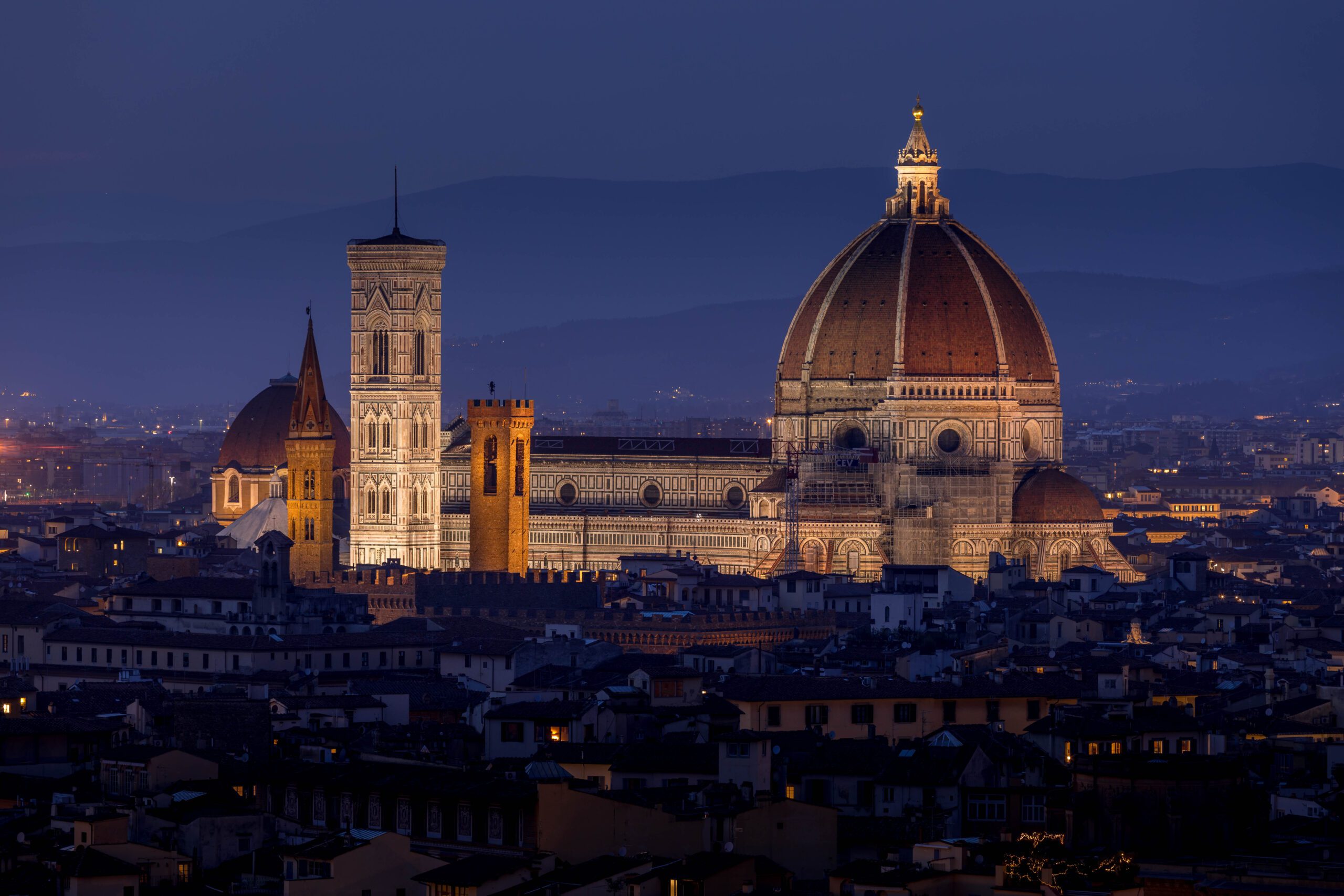 Panoramic view of Florence, Italy, with the Cathedral of Santa Maria del Fiore and red-tiled rooftops