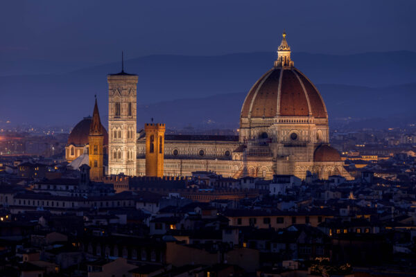 Panoramic view of Florence, Italy, with the Cathedral of Santa Maria del Fiore and red-tiled rooftops