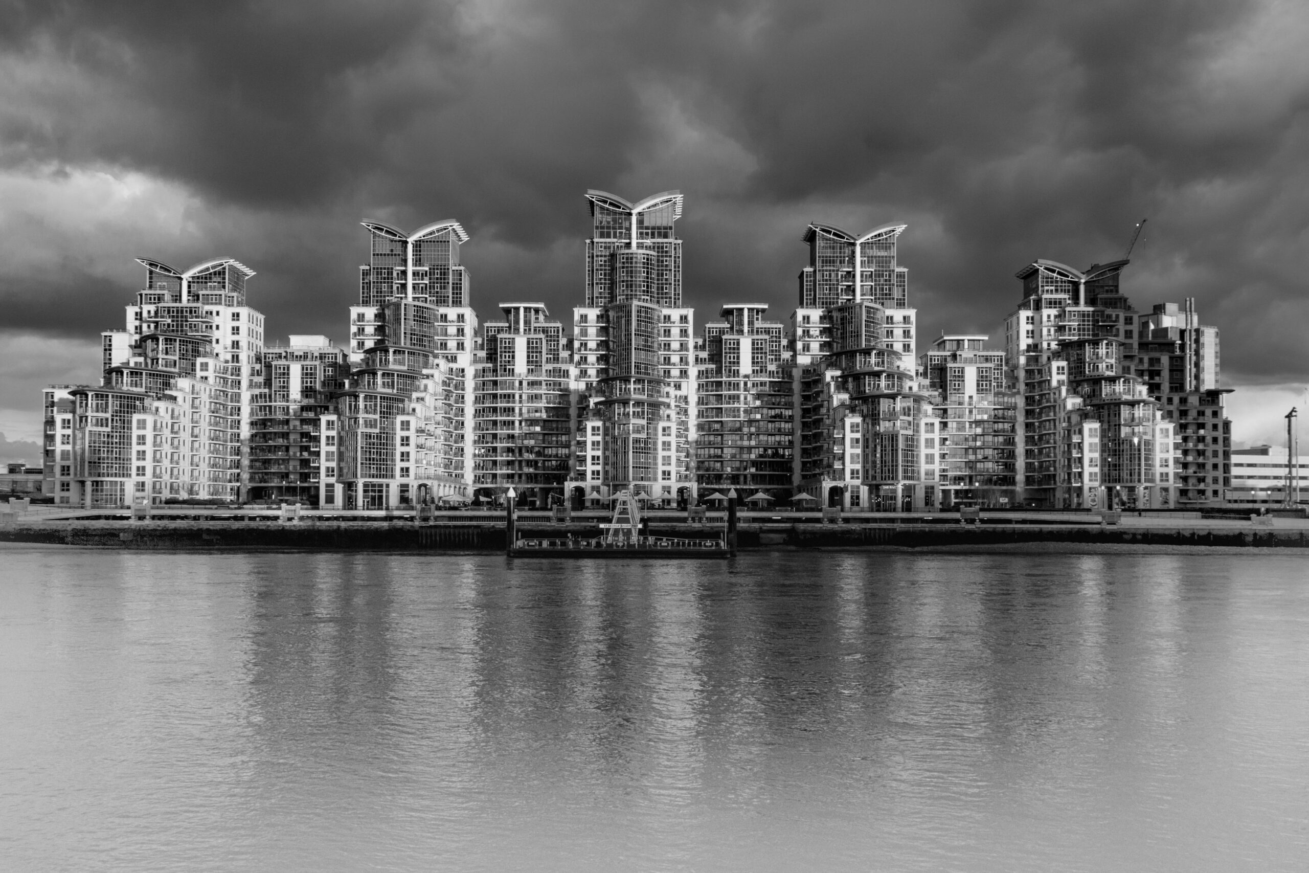 Black and white photograph from London, England, showing modern urban architecture, strong lines, and a quiet city atmosphere.