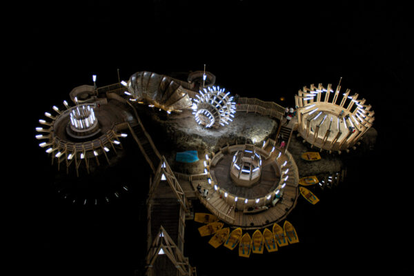 Salina Turda salt mine in Romania with illuminated underground galleries and wooden structures