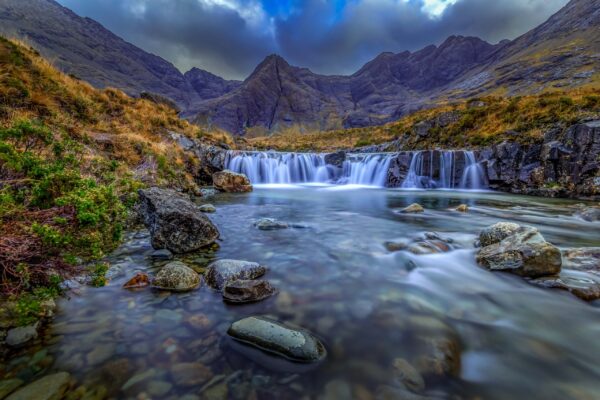 Fairy Pools on the Isle of Skye, Scotland, with crystal-clear waterfalls and the Cuillin mountains in the background
