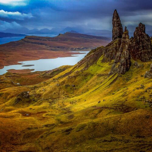 The Old Man of Storr rock formation on the Isle of Skye, Scotland, with rugged cliffs and green slopes