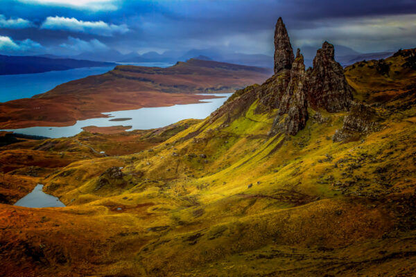 The Old Man of Storr rock formation on the Isle of Skye, Scotland, with rugged cliffs and green slopes