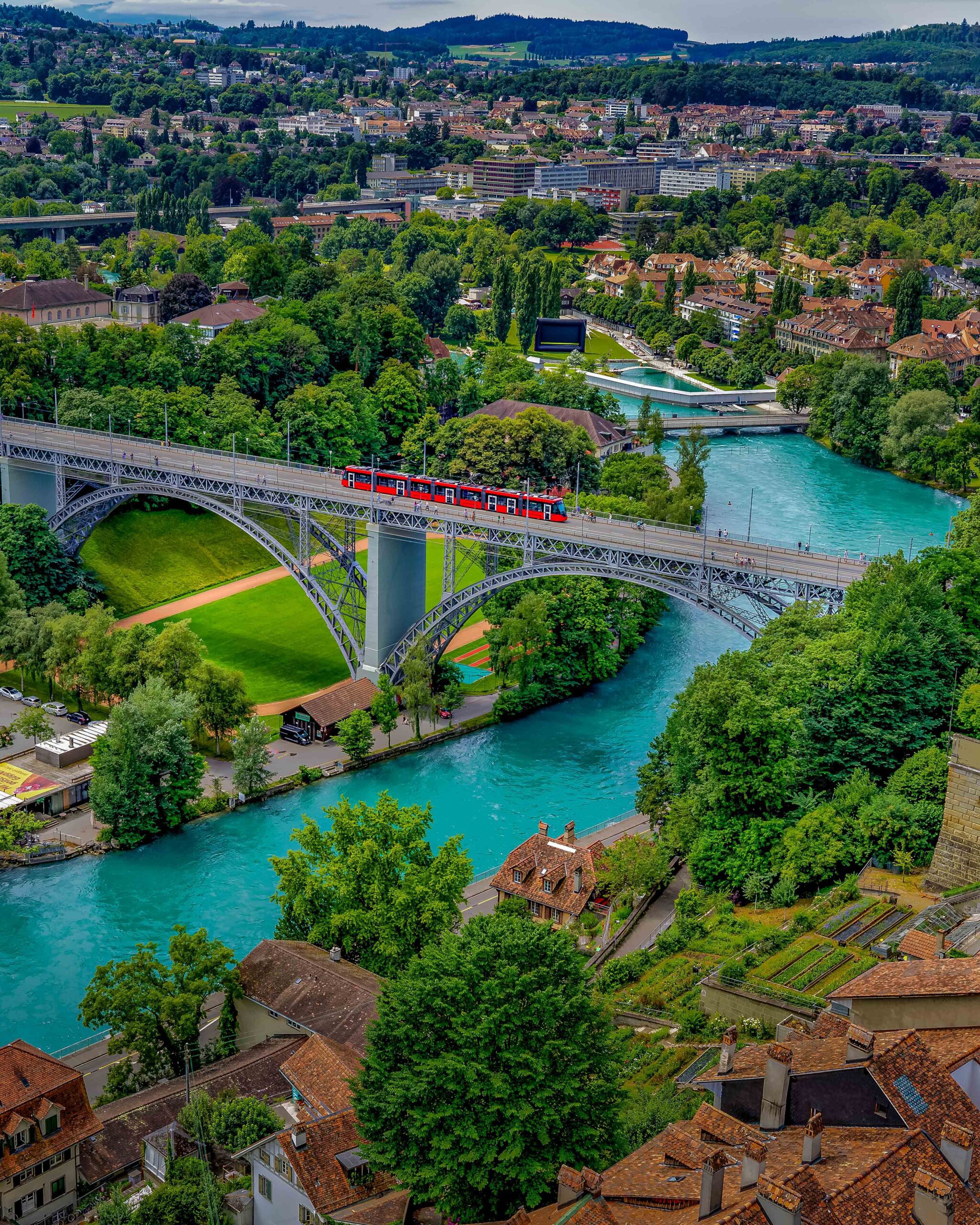 Panoramic view of Bern, Switzerland, with the Aare River curving around the historic Old Town