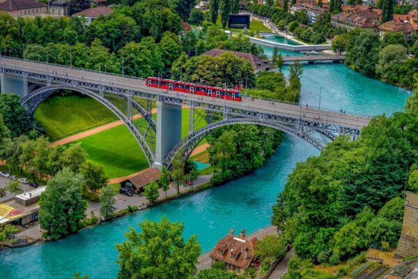 Panoramic view of Bern, Switzerland, with the Aare River curving around the historic Old Town